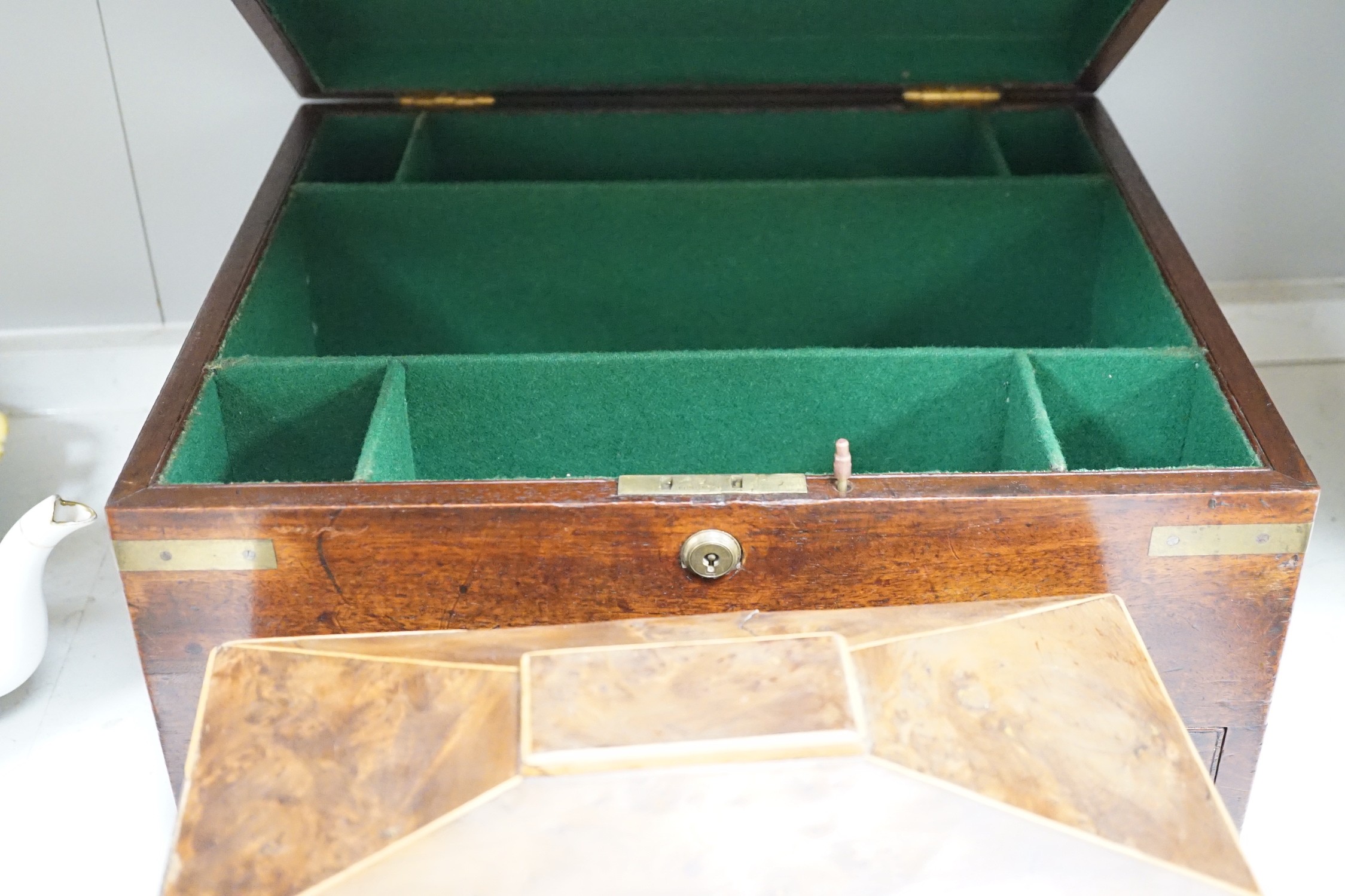 A Victorian boxwood strung burr yew sarcophagus shaped tea caddy, another mahogany tea caddy, a brass bound mahogany silver box with Bramah lock and another mahogany box. Largest 40cm wide